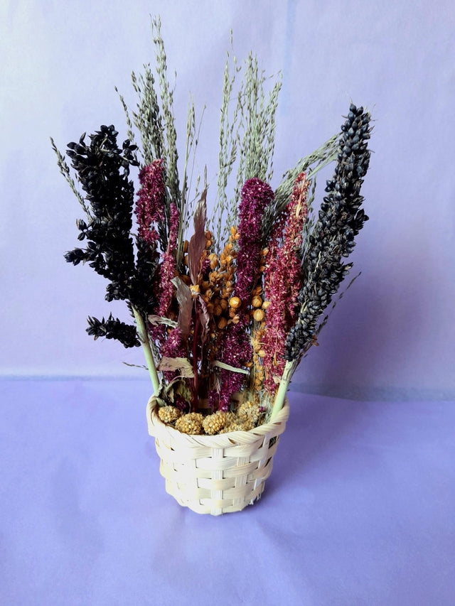 "Handcrafted spray basket filled with natural forage sprays like millet, sorghum, and flax, providing enrichment and foraging fun for small pets."