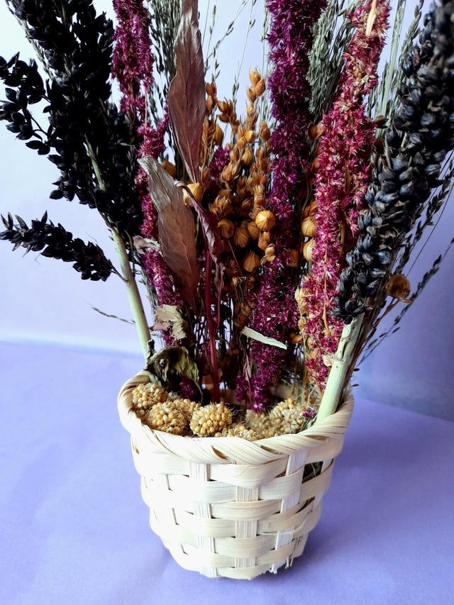 "Handcrafted spray basket filled with natural forage sprays like millet, sorghum, and flax, providing enrichment and foraging fun for small pets."